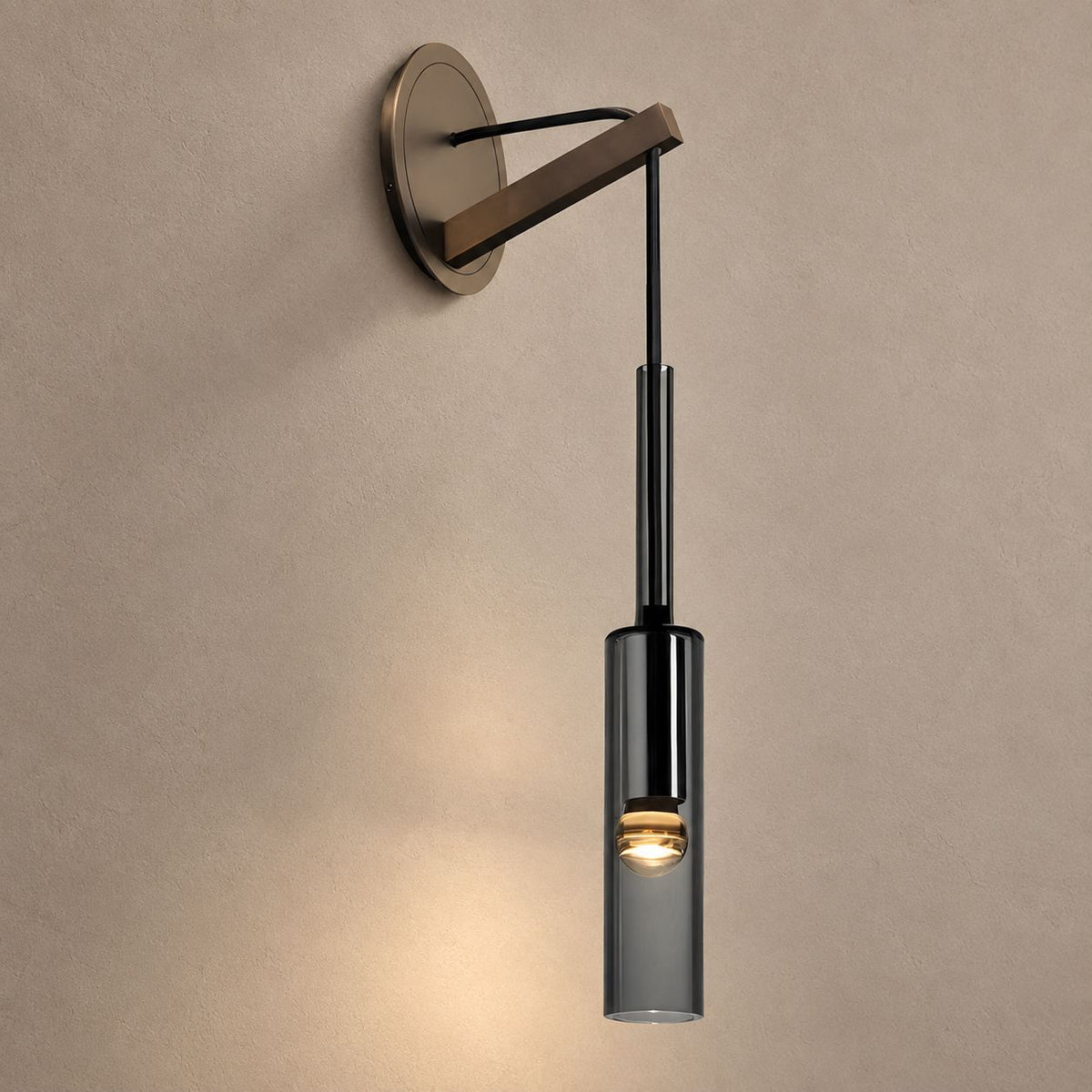 ANDREA bronze wall pendant sconce with smoky cylindrical glass on mushroom taupe plaster