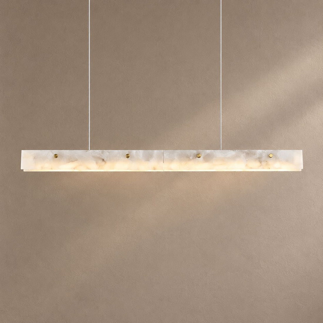 AURALIS lighting on a mushroom taupe background with natural shadows