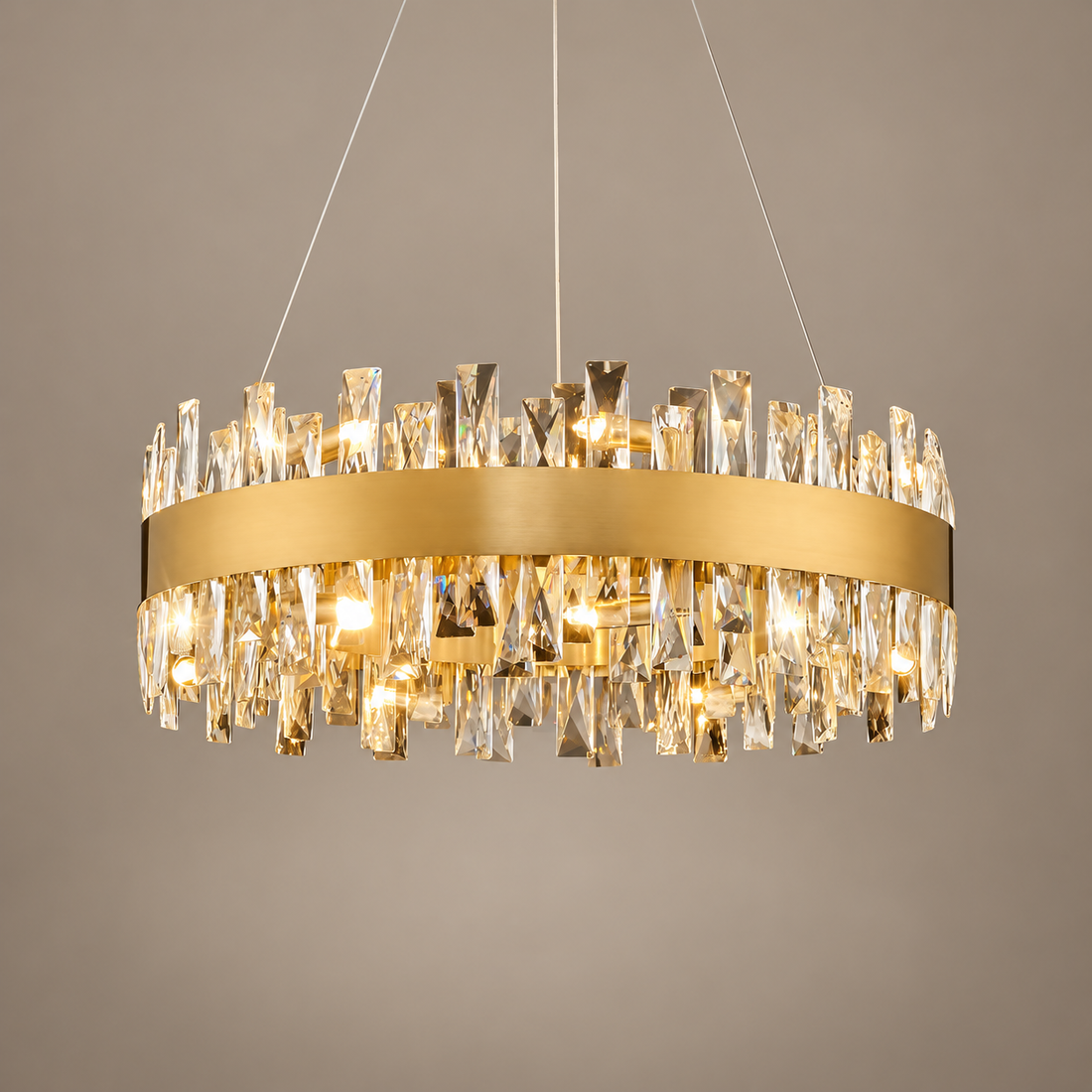 AURYNE gold round crystal chandelier on a mushroom taupe background