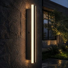 Bolt Light Sensor side photocell detail on a wet stone wall