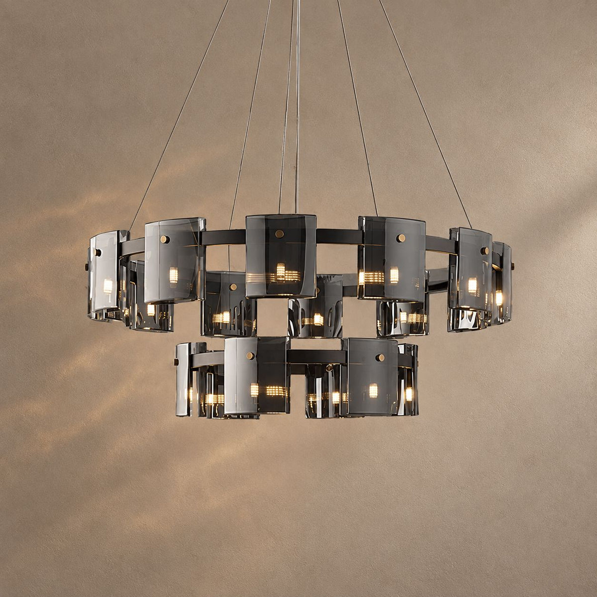 CALYX lighting on a mushroom taupe background with natural shadows