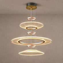 CIRCA three-tier gold lattice chandelier on mushroom taupe plaster with natural shadows