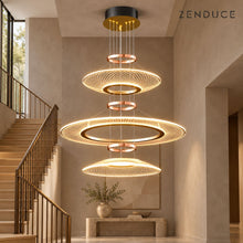 CIRCA triple-tier gold lattice chandelier in a warm taupe stairwell