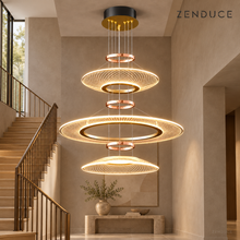 CIRCA triple-tier gold lattice chandelier in a warm taupe stairwell