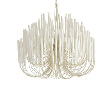 CERYNE - Close view of white wooden sticks and curved iron framework