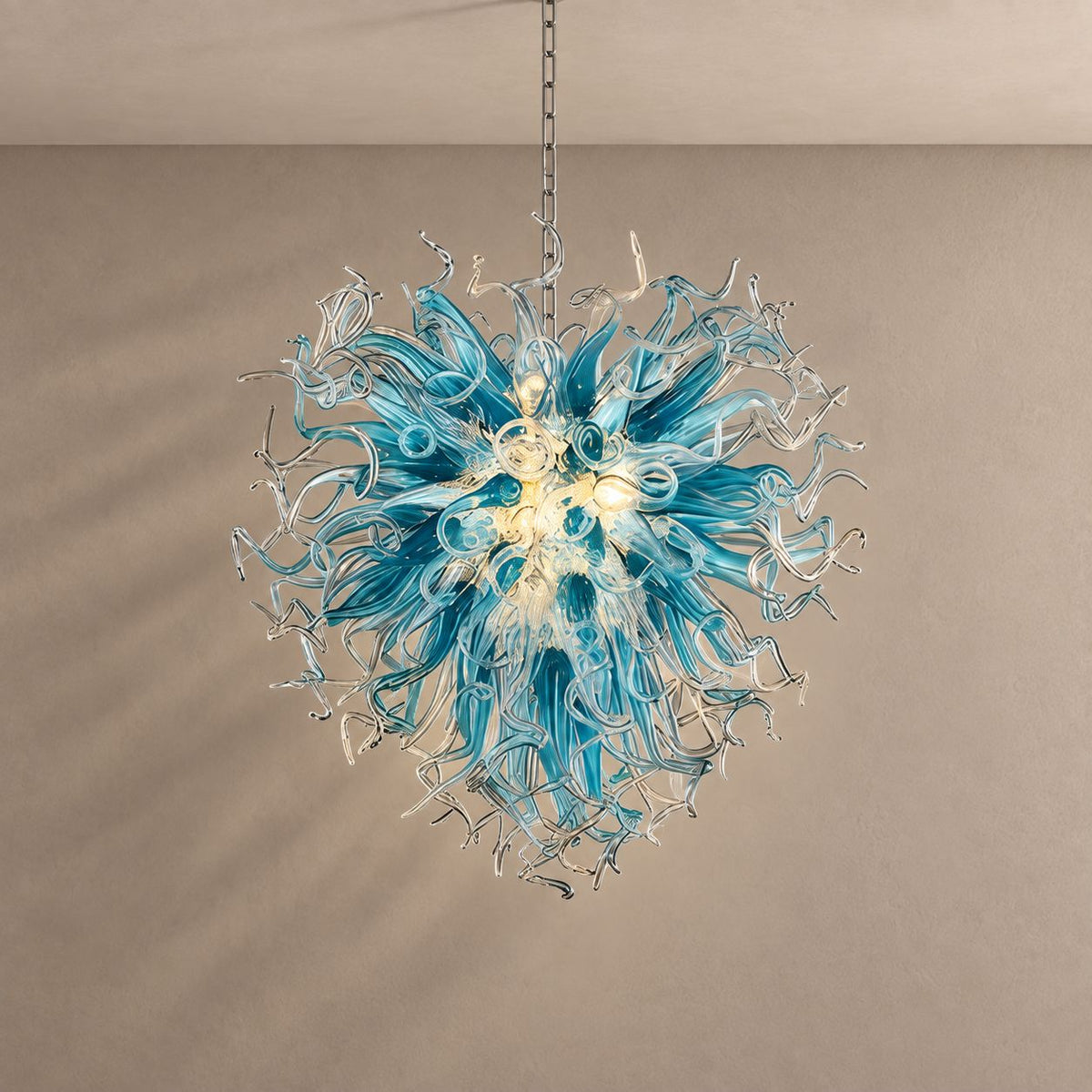 CORAL chandelier on mushroom taupe with soft natural shadows