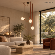 CORIA three-light Red leather chandelier in a contemporary living room