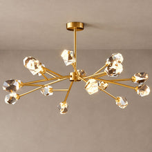 CRYSTAL ROCK semi-flush gold chandelier with faceted crystal heads against mushroom taupe plaster and natural shadows
