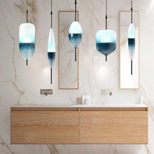 NERINA - Gradient glass pendant shapes in an interior setting