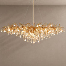 DRIBBLE Gold linear crystal branch chandelier with natural shadows on a mushroom taupe background