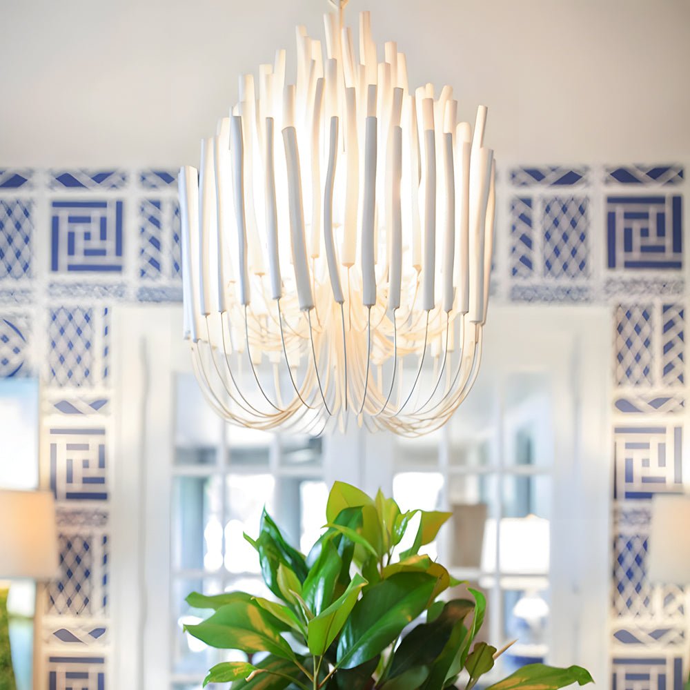 CERYNE - White wooden sticks and curved arms above a dining area