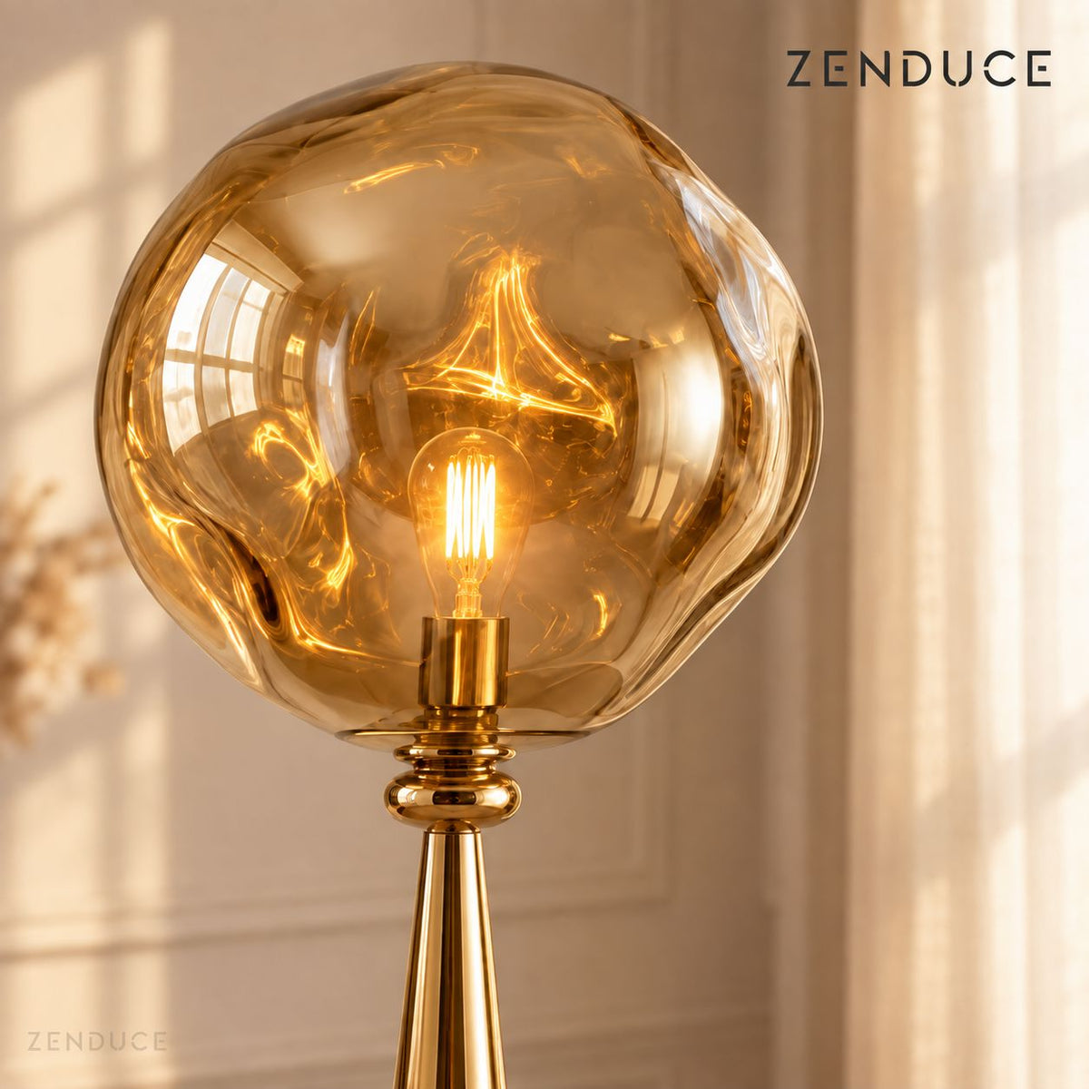 LAVA FLOOR Gold close-up showing the organically shaped reflective acrylic shade and warm LED bulb