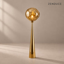 ELUNE Gold acrylic floor lamp with matching reflective conical pedestal and natural shadow