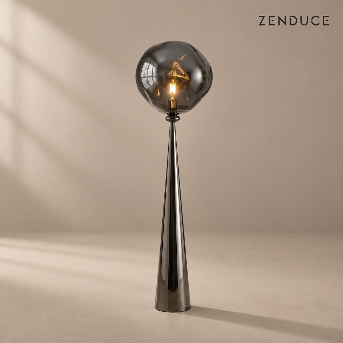 ELUNE Smoky Gray sculptural floor lamp on a mushroom taupe background with natural shadow
