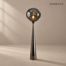 ELUNE Smoky Gray sculptural floor lamp on a mushroom taupe background with natural shadow
