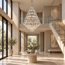 SERAPHINE chrome crystal chandelier in a travertine double-height entry