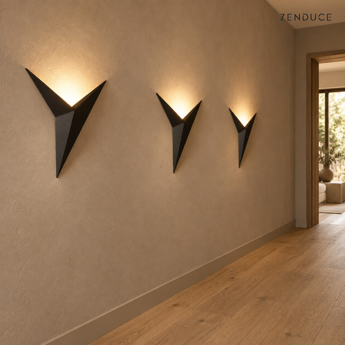 Three EZIA black wall lights along a contemporary hallway; fixtures sold individually