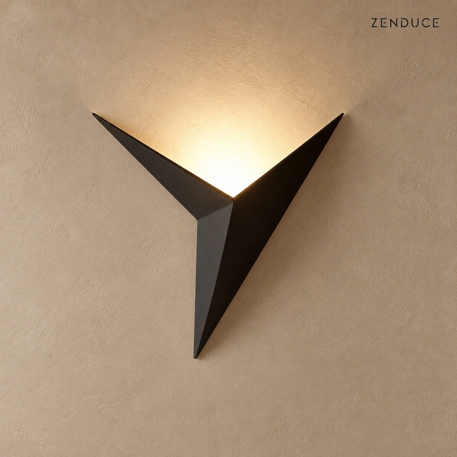 EZIA black geometric LED wall light on mushroom taupe with natural shadow