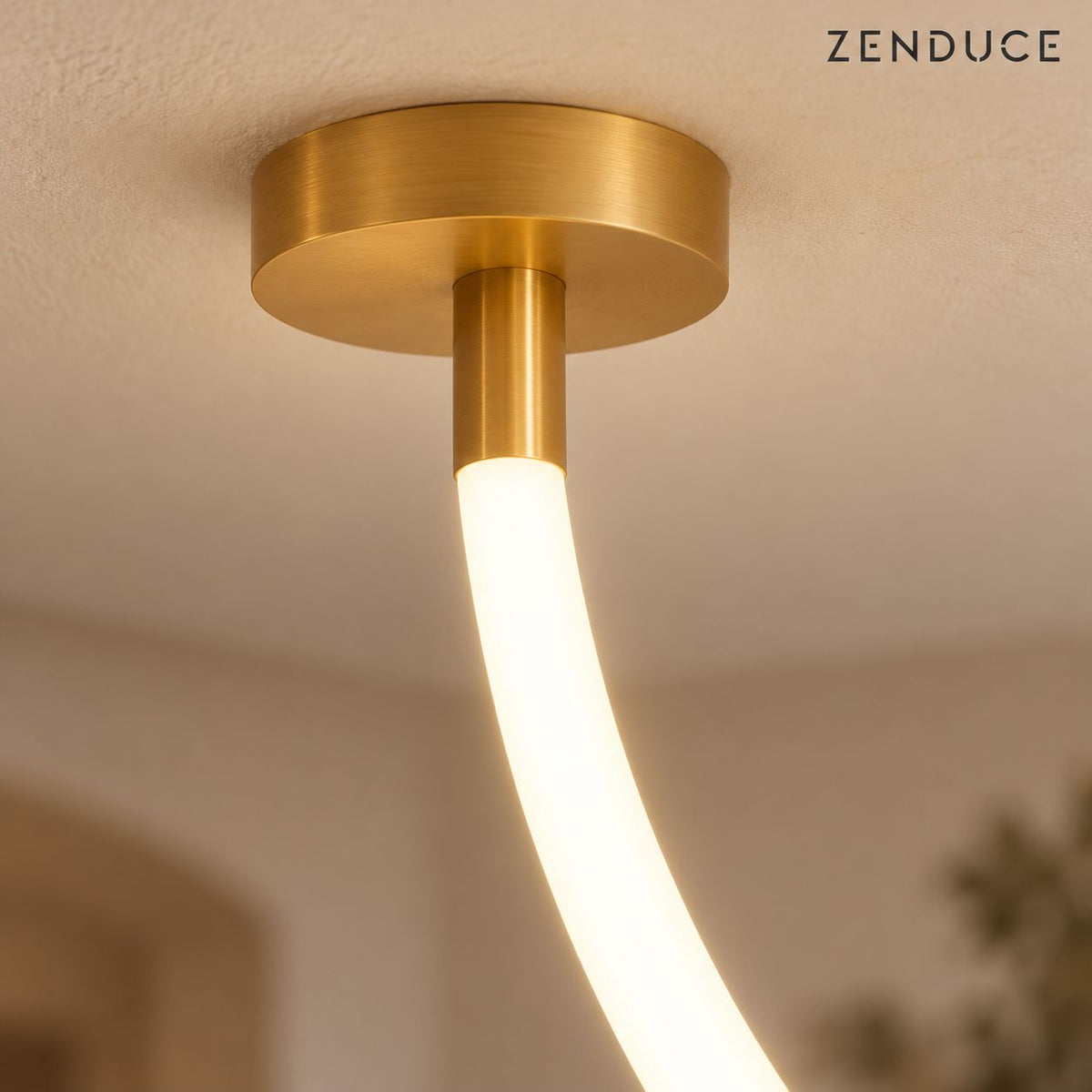 FENNA close-up of brushed gold ceiling canopy, short connector and round opal silicone LED tube