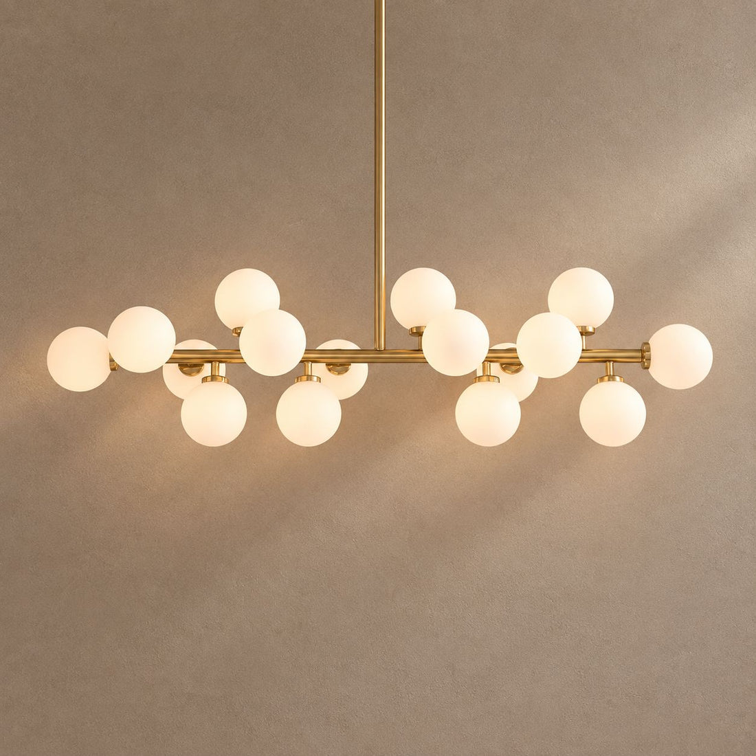 GLASS GLOBES on mushroom taupe background with natural shadows