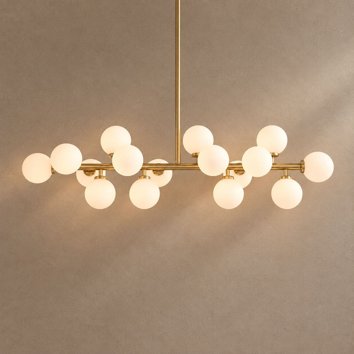 GLASS GLOBES on mushroom taupe background with natural shadows