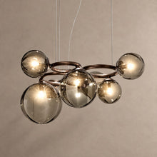 GLOBIQUE bronze chandelier with smoky glass globes on mushroom taupe plaster