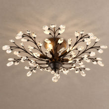IRIS dark floral crystal ceiling light on mushroom taupe plaster with soft natural shadows