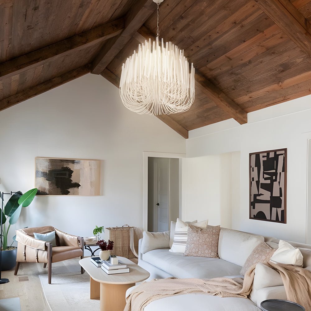 CERYNE - White wood chandelier beneath timber beams in a living room
