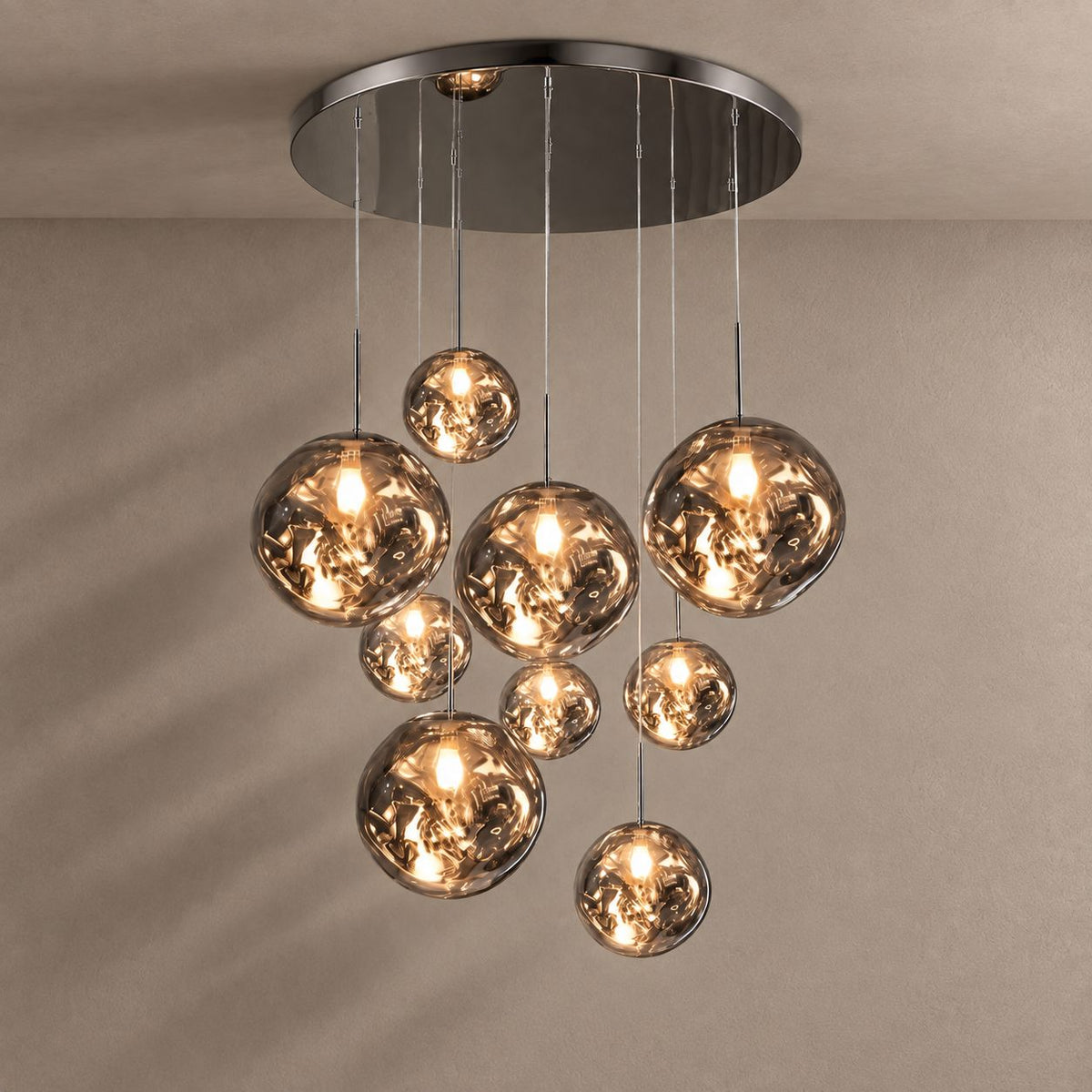 LAVA DROPS lighting with natural shadows against a mushroom taupe background