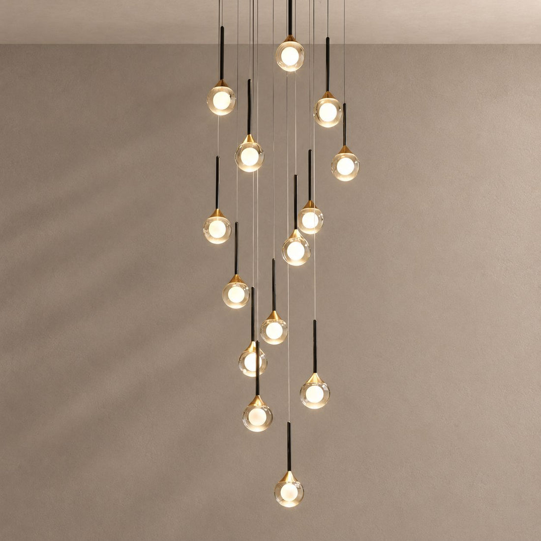LOIMATA chandelier on mushroom taupe with soft natural shadows