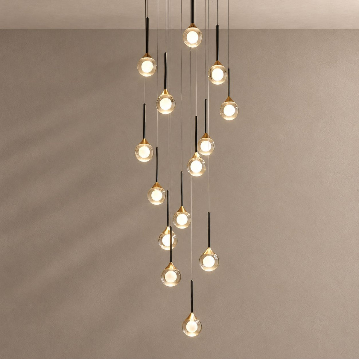 LOIMATA chandelier on mushroom taupe with soft natural shadows