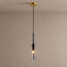 LYRA single smoked glass cylinder pendant with a brass ceiling canopy against mushroom taupe plaster