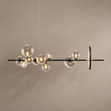 MACROCOSM black linear chandelier with ten clear glass globes and a vertical LED ring on mushroom taupe