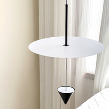 CONIA - Disc and cone pendant shown beside a window