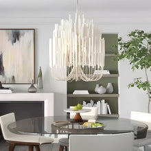 CERYNE - White wood chandelier in a contemporary living and dining space