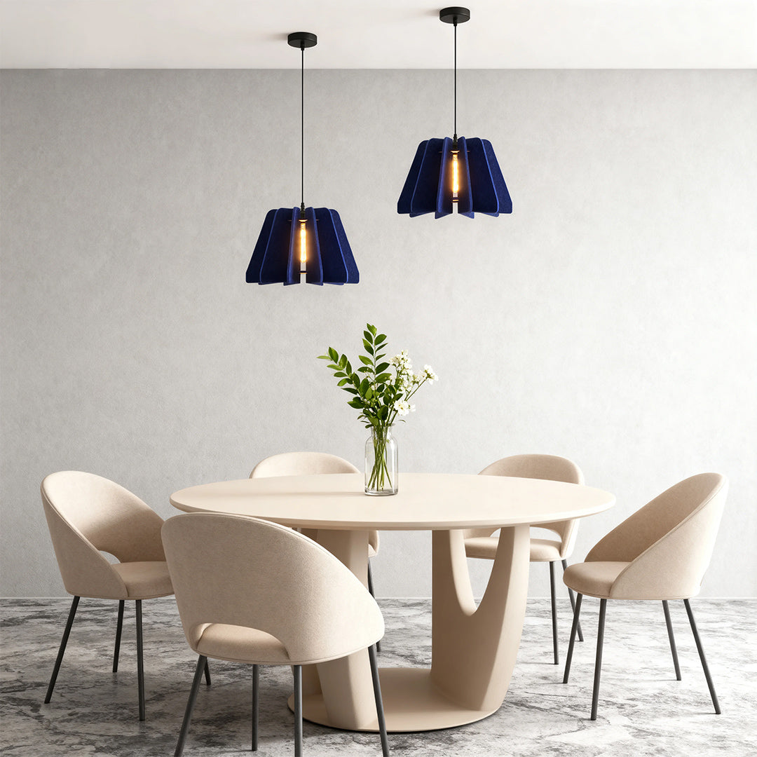 FELLA - Blue felt pendants over a round dining table