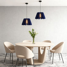 FELLA - Blue felt pendants over a round dining table