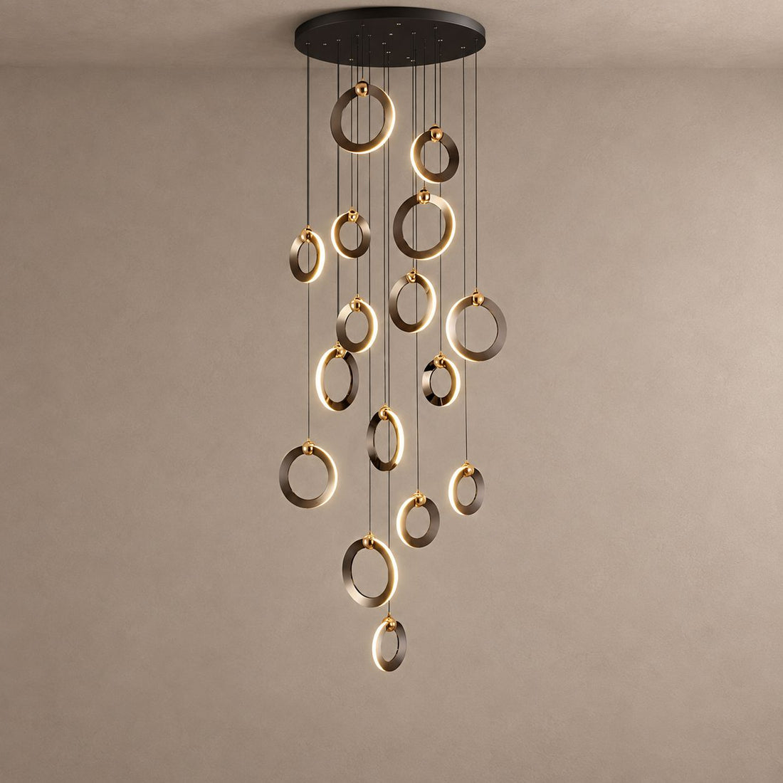 NEBULA polished ring cascade chandelier on mushroom taupe plaster with natural ceiling shadows