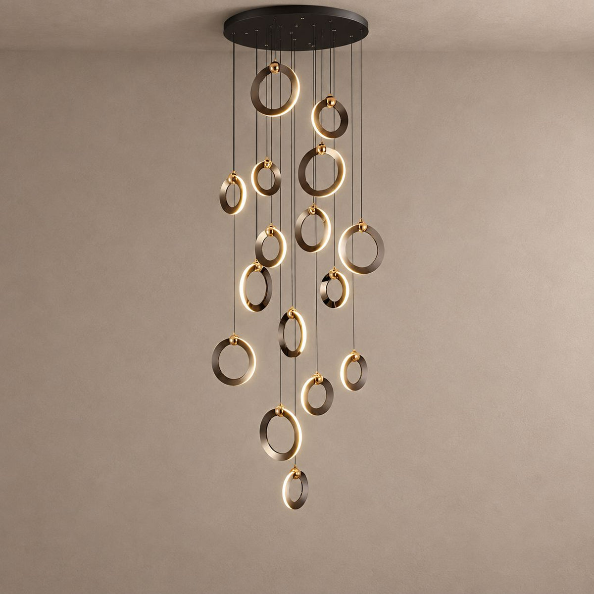 NEBULA polished ring cascade chandelier on mushroom taupe plaster with natural ceiling shadows