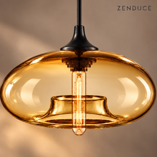 Close-up of the Amber NELIA glass shade, black fitting and visible tubular bulb