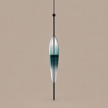 NERINA A Spindle pendant with blue-green gradient glass and black stem on mushroom taupe