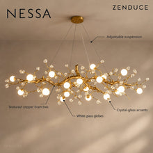 NESSA material and suspension detail: copper branches, crystal-glass accents and white glass globes