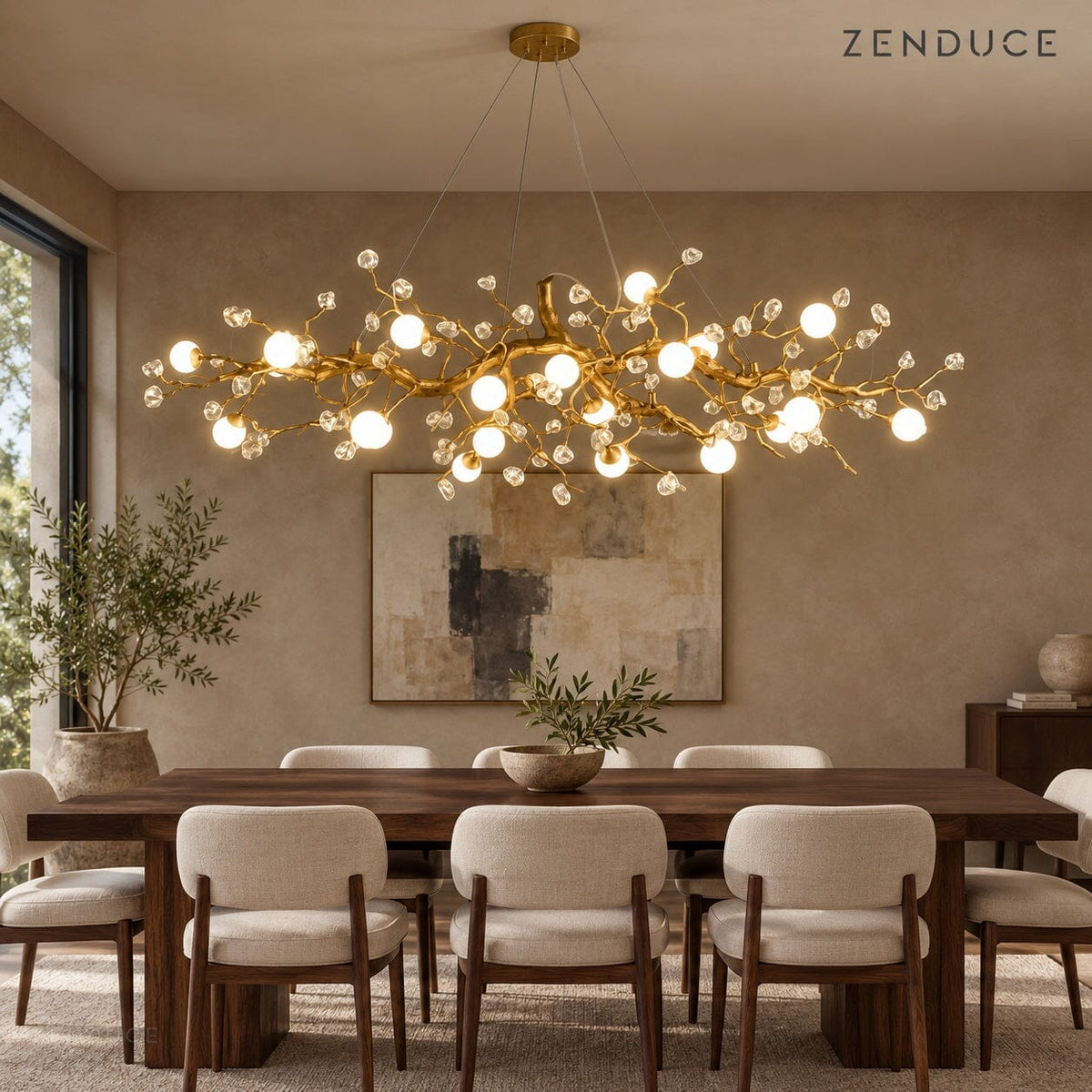 NESSA Gold branch chandelier styled above a walnut dining table with cream upholstered chairs