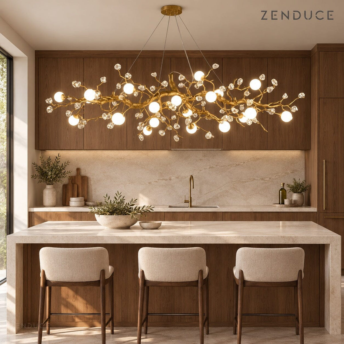 NESSA Gold chandelier above an ivory stone kitchen island with walnut cabinetry