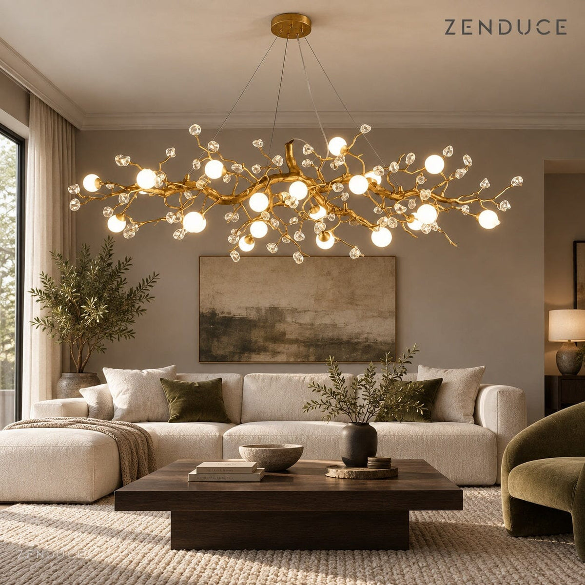 NESSA Gold linear chandelier in a neutral living room above a broad coffee table