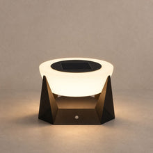 NOCTARA solar outdoor lamp with a glowing round diffuser and dark angular base on mushroom taupe