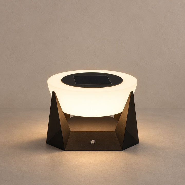 NOCTARA solar outdoor lamp with a glowing round diffuser and dark angular base on mushroom taupe