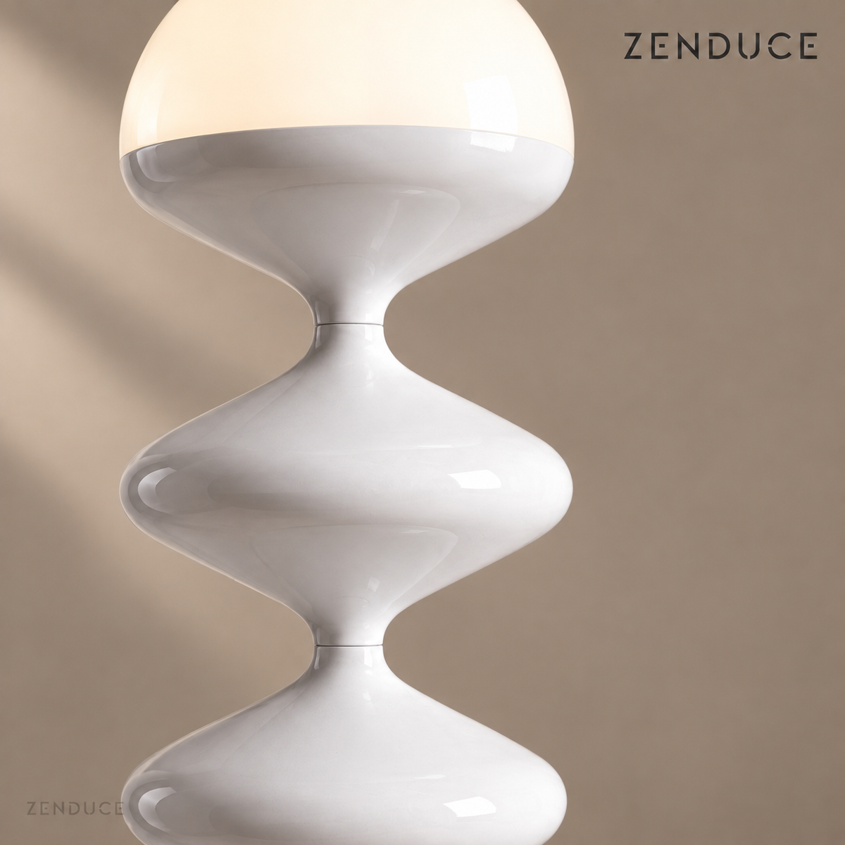 Close-up of NOLIA white gloss metal curves, narrow joins, and warm illuminated dome