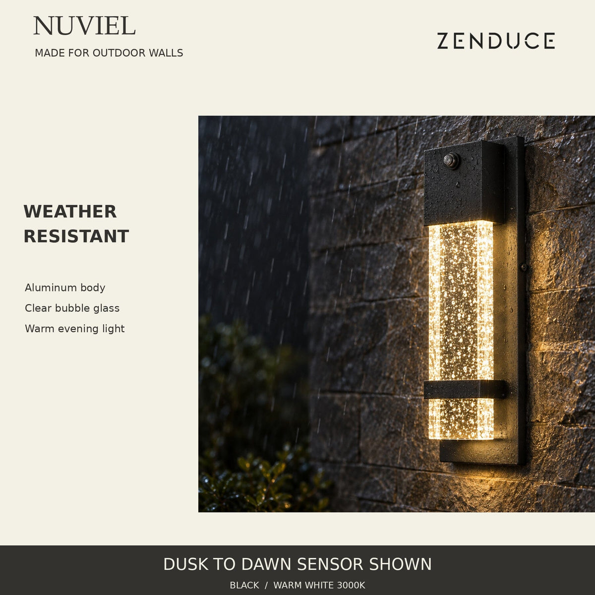 NUVIEL Dusk to Dawn Sensor in evening rain, showing weather-resistant black aluminum, clear bubble glass and warm downward light.