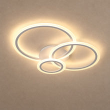 OLYMPIA lighting on a mushroom taupe background with natural shadows